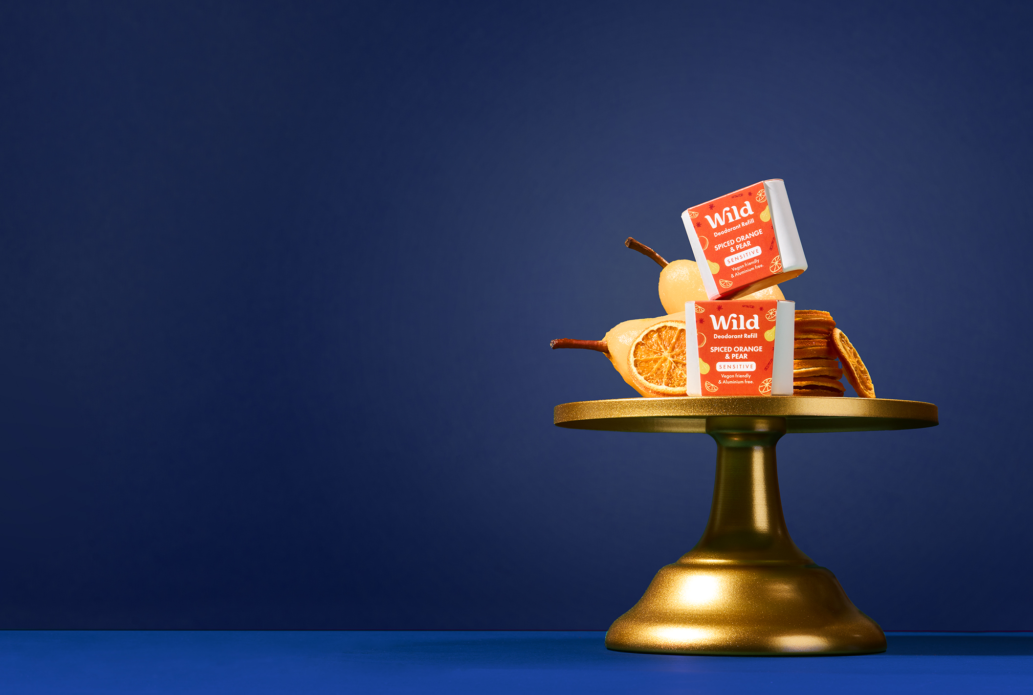 Caption: a golden stand with oranges and bars on it