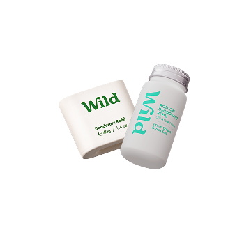 Caption: a bottle of wild toothpaste next to a tube of toothpaste