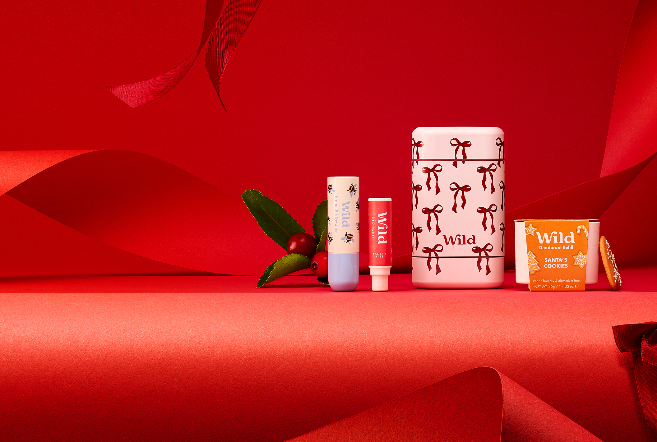 Caption: a group of different types of lipstick on a red surface