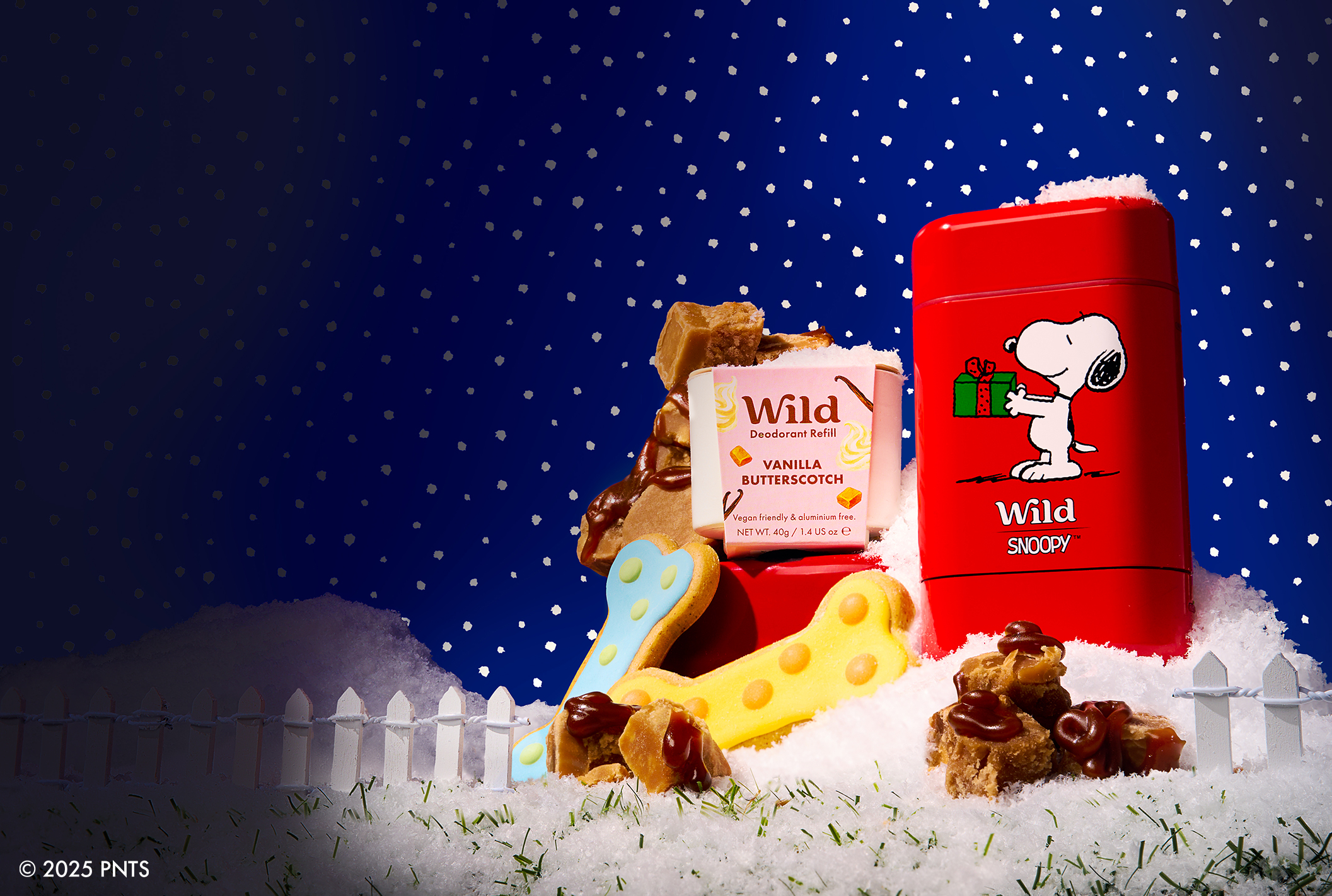 Caption: a red tin with a dog bone and a cookie next to it