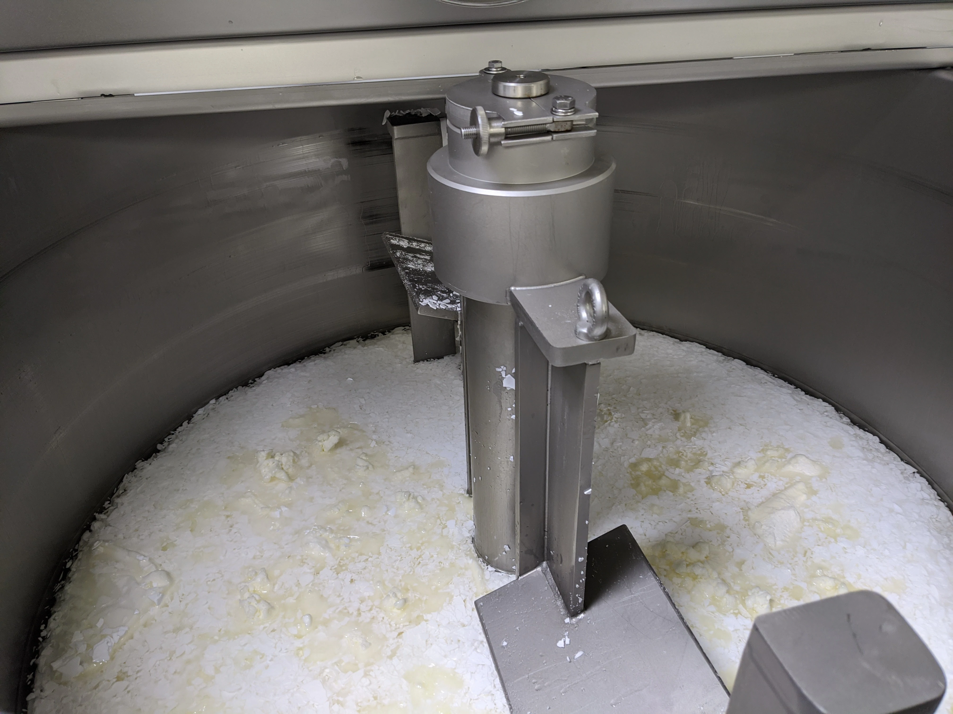 Caption: a machine that is making some kind of food