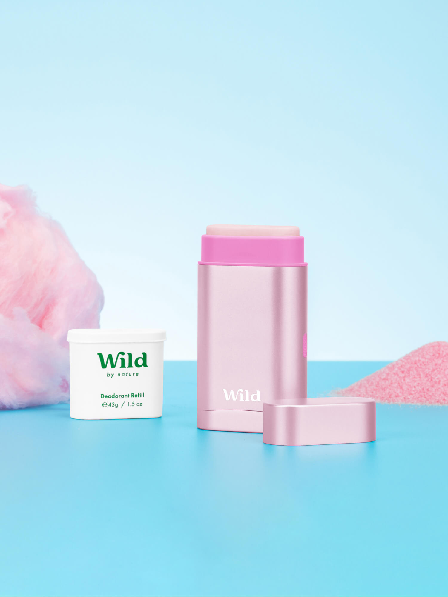 Bildunterschrift: ein rosa Behälter neben einem rosa Pulver und einem weißen Behälter