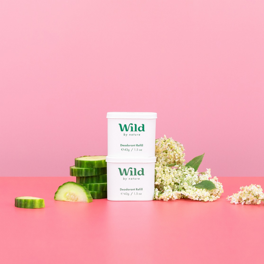 Caption: a pink table with a container of wild