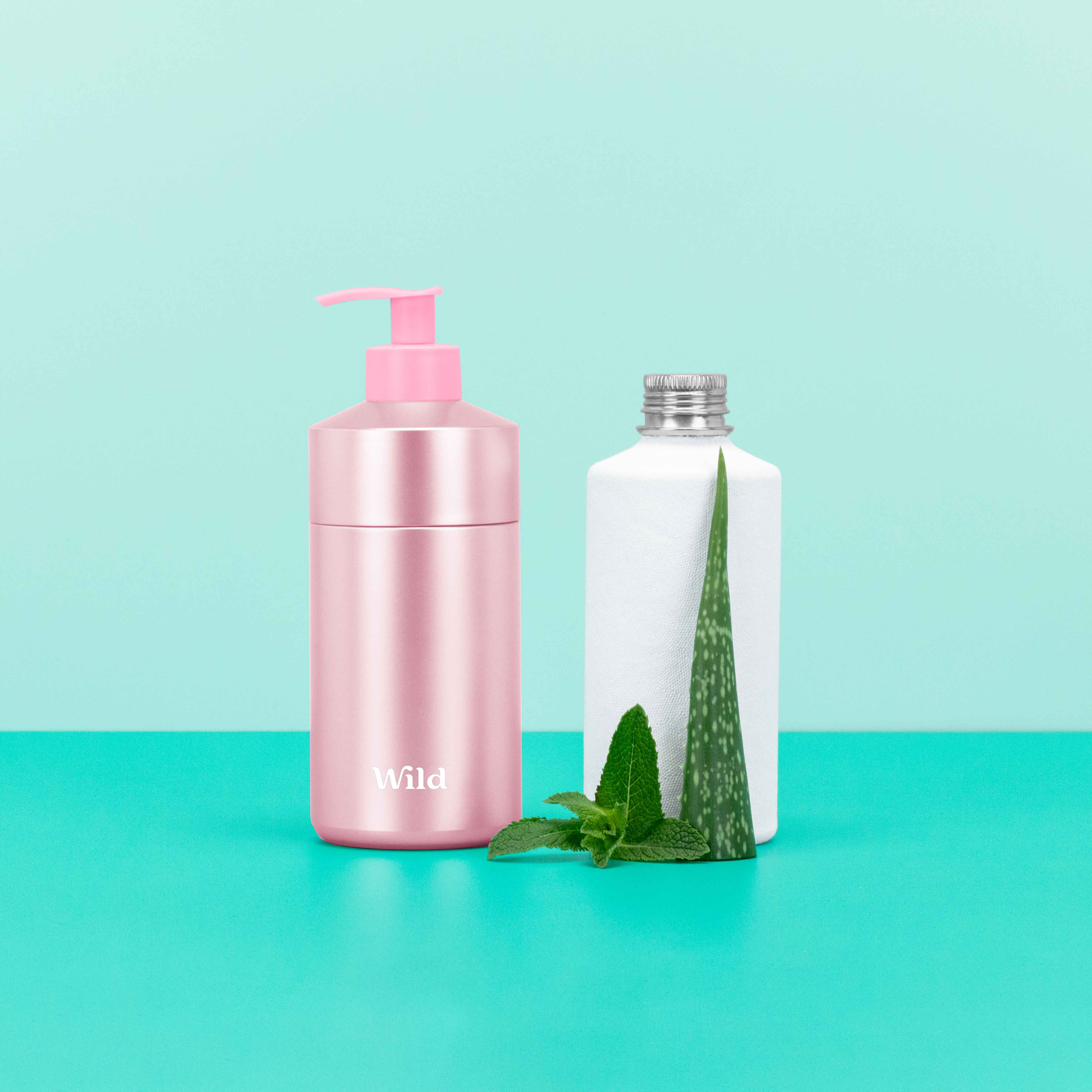 Caption: a bottle of lotion, a bottle of aloem and a aloe