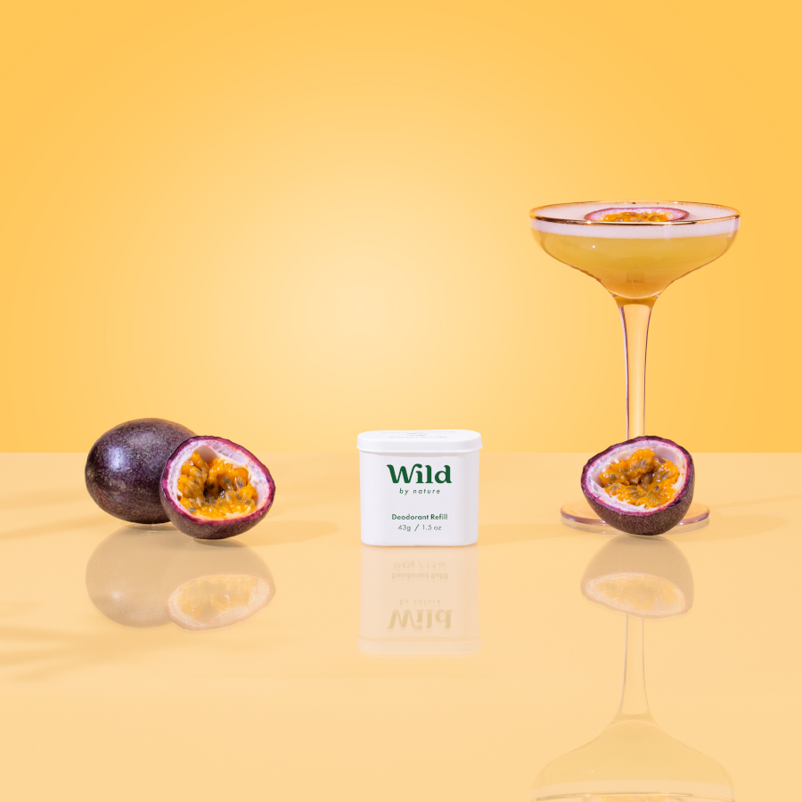 Caption: a glass of wine next to some fruit