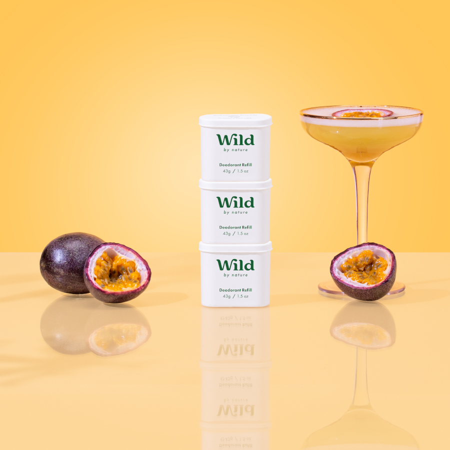 Caption: a bottle of wild next to some fruit