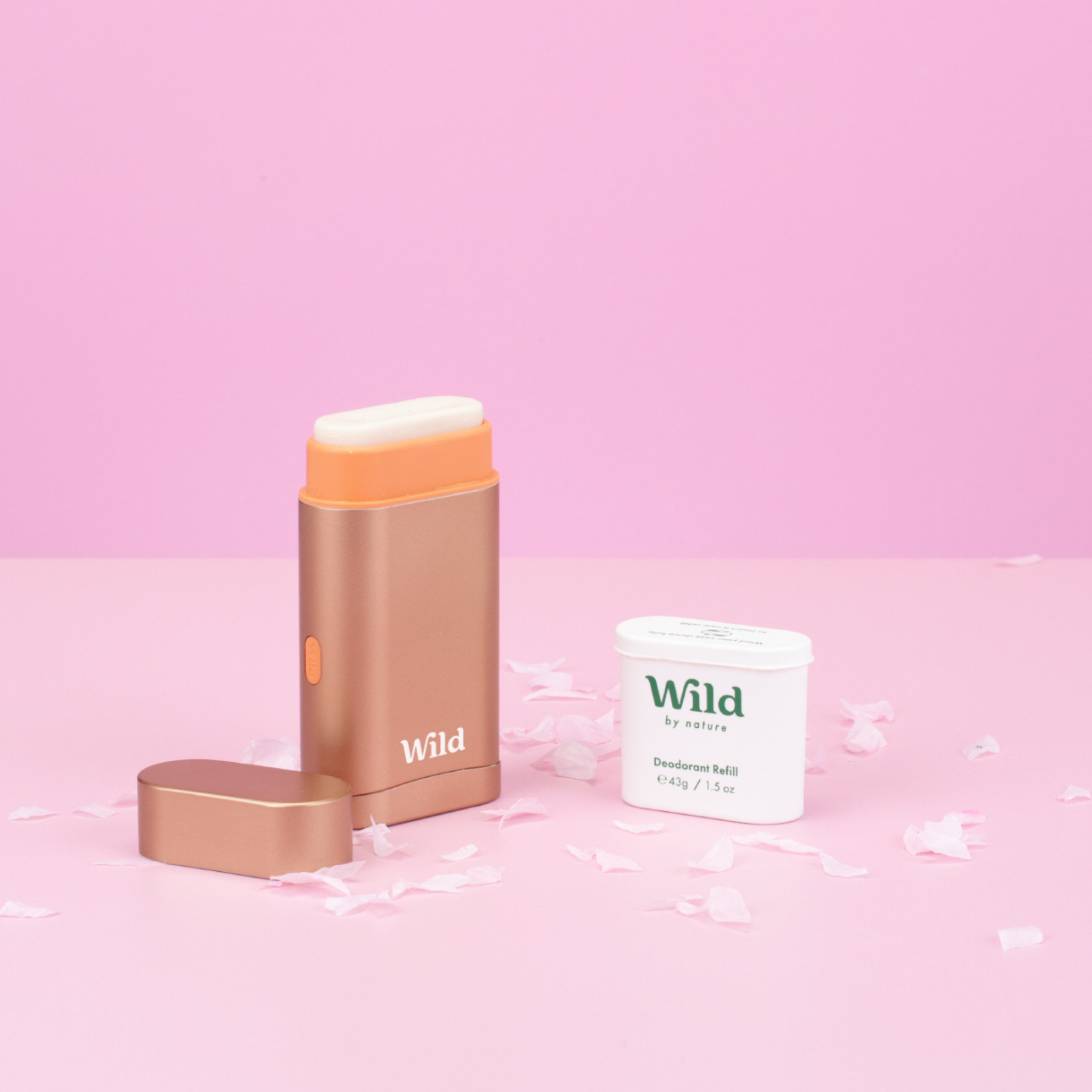 Caption: a pink background with a gold lipstick and a white container