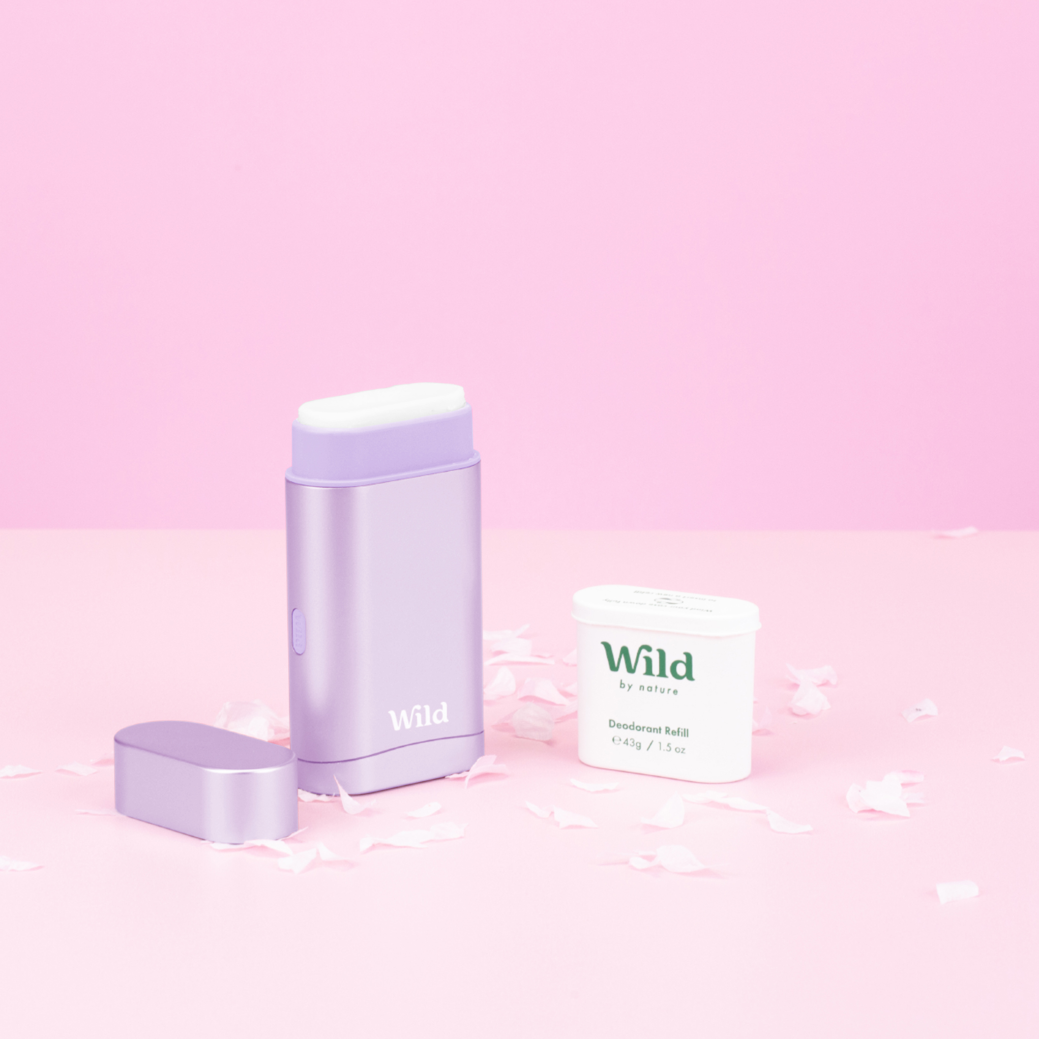 Caption: a white container sitting next to a white container on a pink surface