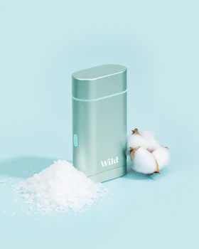 Caption: a metal container sitting next to a pile of cotton