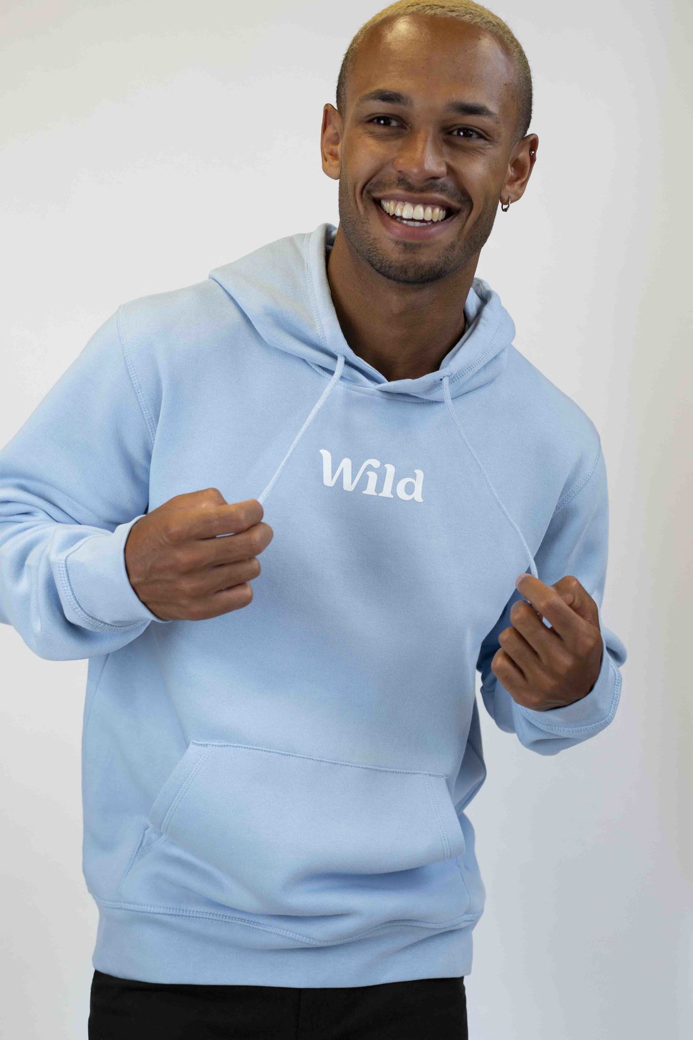 Caption: a man wearing a blue hoodie with the word wild on it