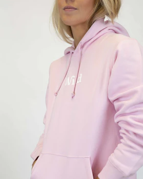 Caption: a woman in a pink hoodie is posing for a picture
