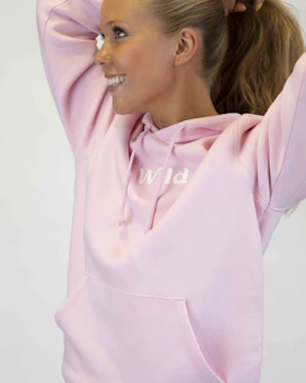 Caption: a woman with her hair in a ponytail