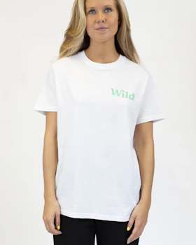 Caption: a woman wearing a white shirt and black pants