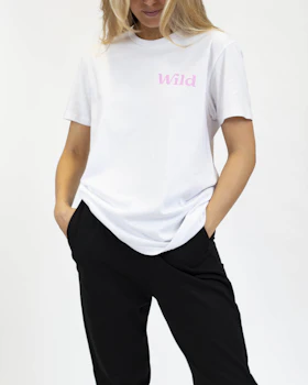 Caption: a woman in a white shirt and black pants