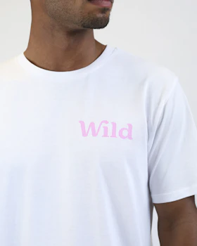 Caption: a man wearing a white t - shirt with the word wild printed on it
