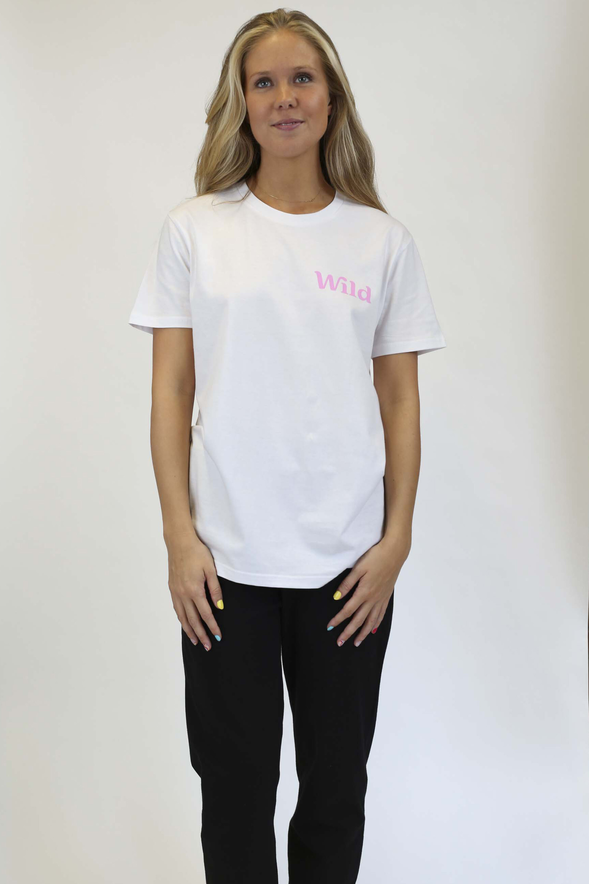 Caption: a woman standing in front of a white background