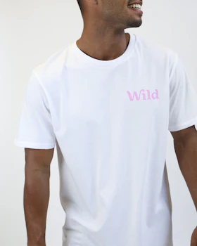 Caption: a man wearing a white t - shirt with the word wild printed on it