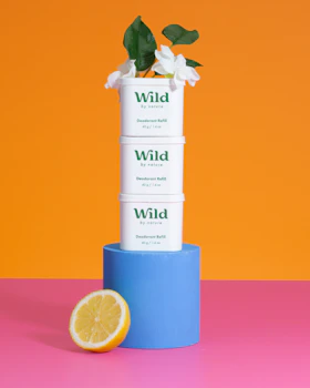 Caption: a stack of three boxes sitting on top of a table