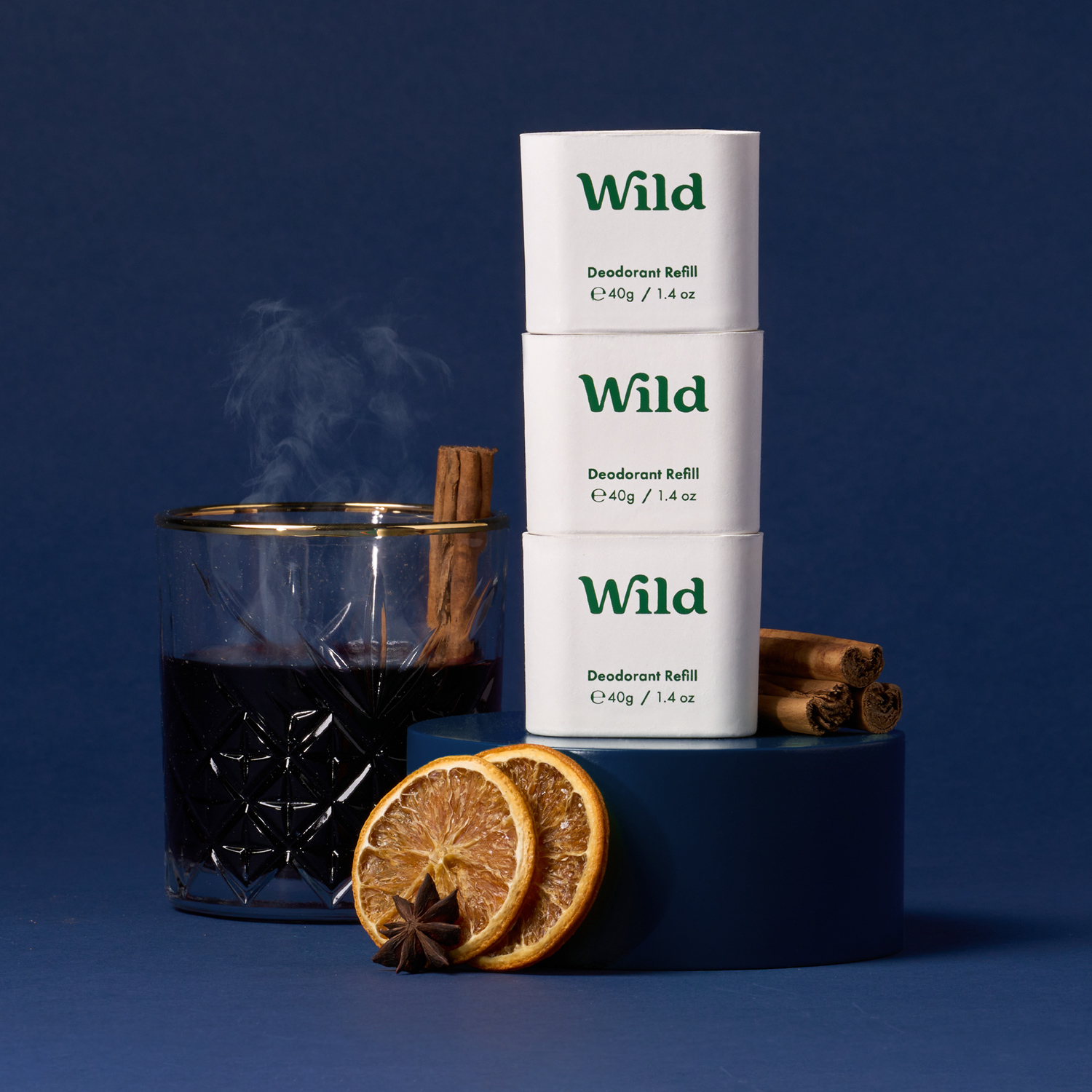 Caption: a cup of tea next to a stack of cigarettes