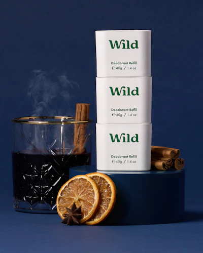 Caption: a cup of tea next to a stack of cigarettes