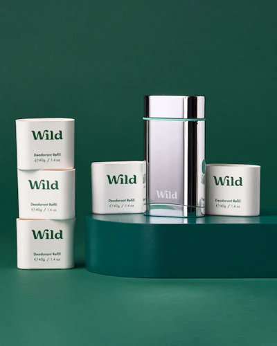 Caption: a group of three white containers sitting on top of a table