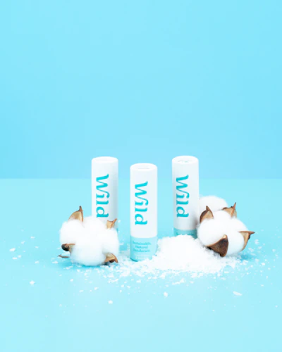 Caption: three lip bales with cotton on a blue background