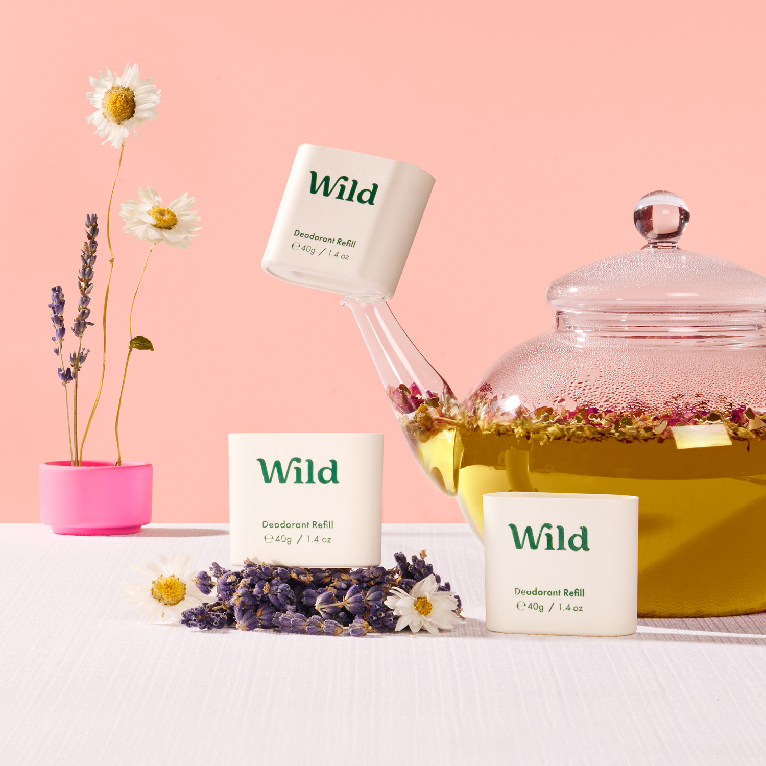 Caption: a jar of wild tea next to a cup of tea