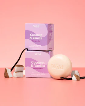 Caption: a couple of soaps sitting on top of a pink table