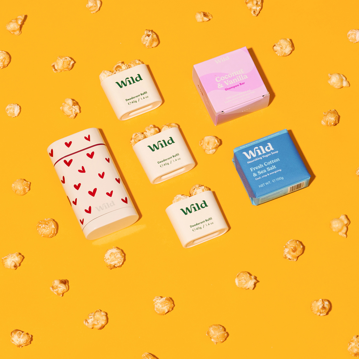 Caption: a couple of boxes of soap sitting on top of a yellow surface