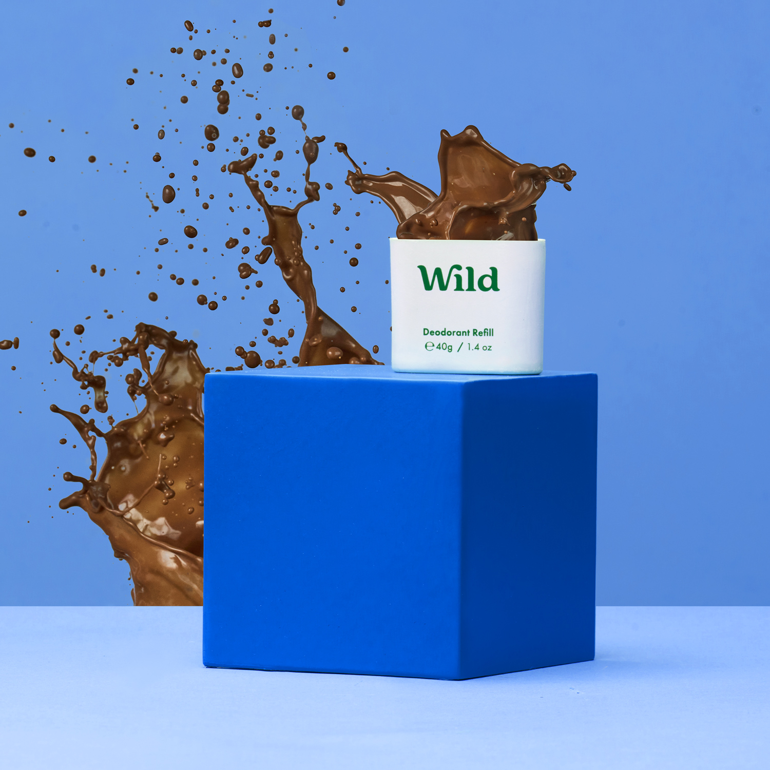 Caption: a can of wild on top of a blue block
