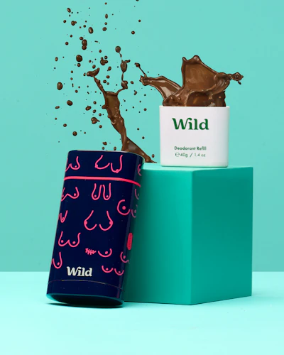 Caption: a blue box with a chocolate splash coming out of it