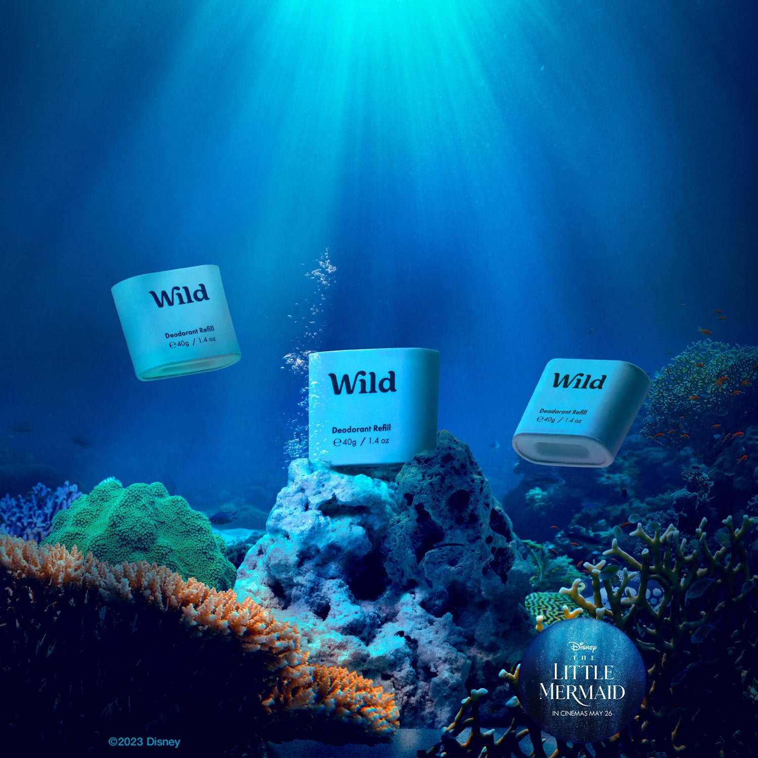 Caption: a blue underwater scene with three books floating in the air