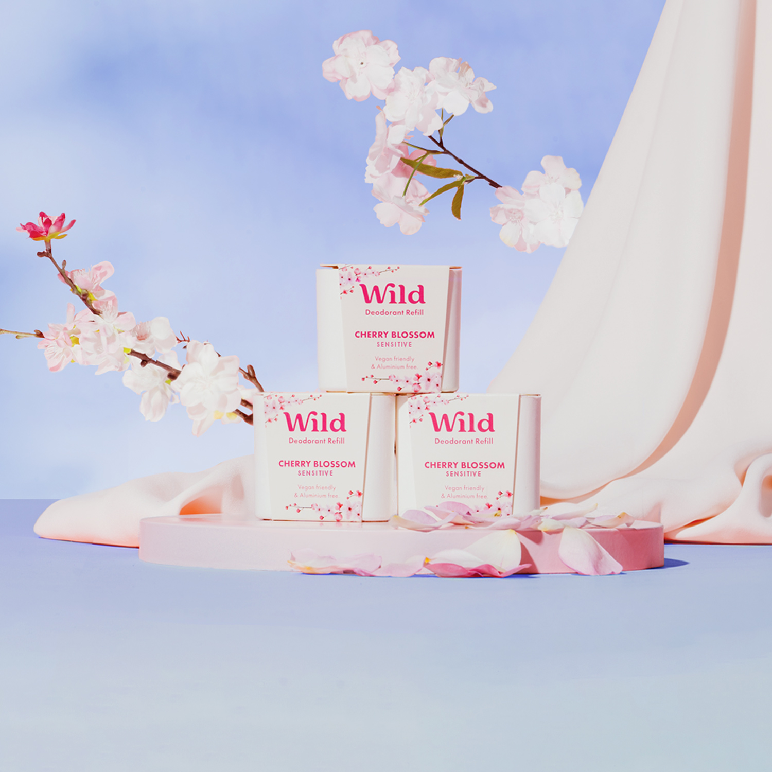 Caption: a white table topped with three boxes of body lotion