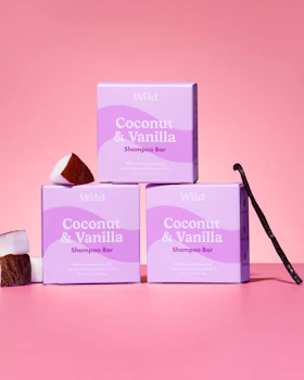 Caption: three boxes of coconut and vanilla soap on a pink background