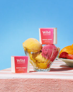 Caption: a bowl of fruit sitting on top of a table