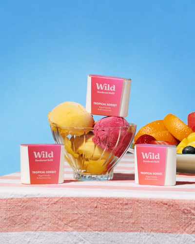 Caption: a bowl of fruit sitting on top of a table