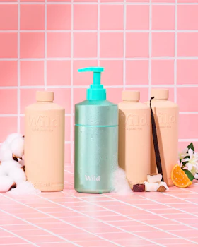 Caption: a bottle of lotion, a bottle of soap and a bottle of lotion