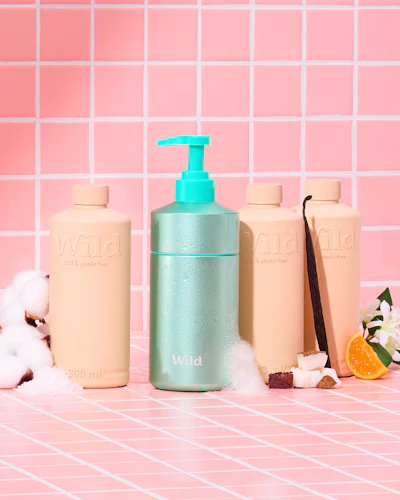 Caption: a bottle of lotion, a bottle of soap and a bottle of lotion