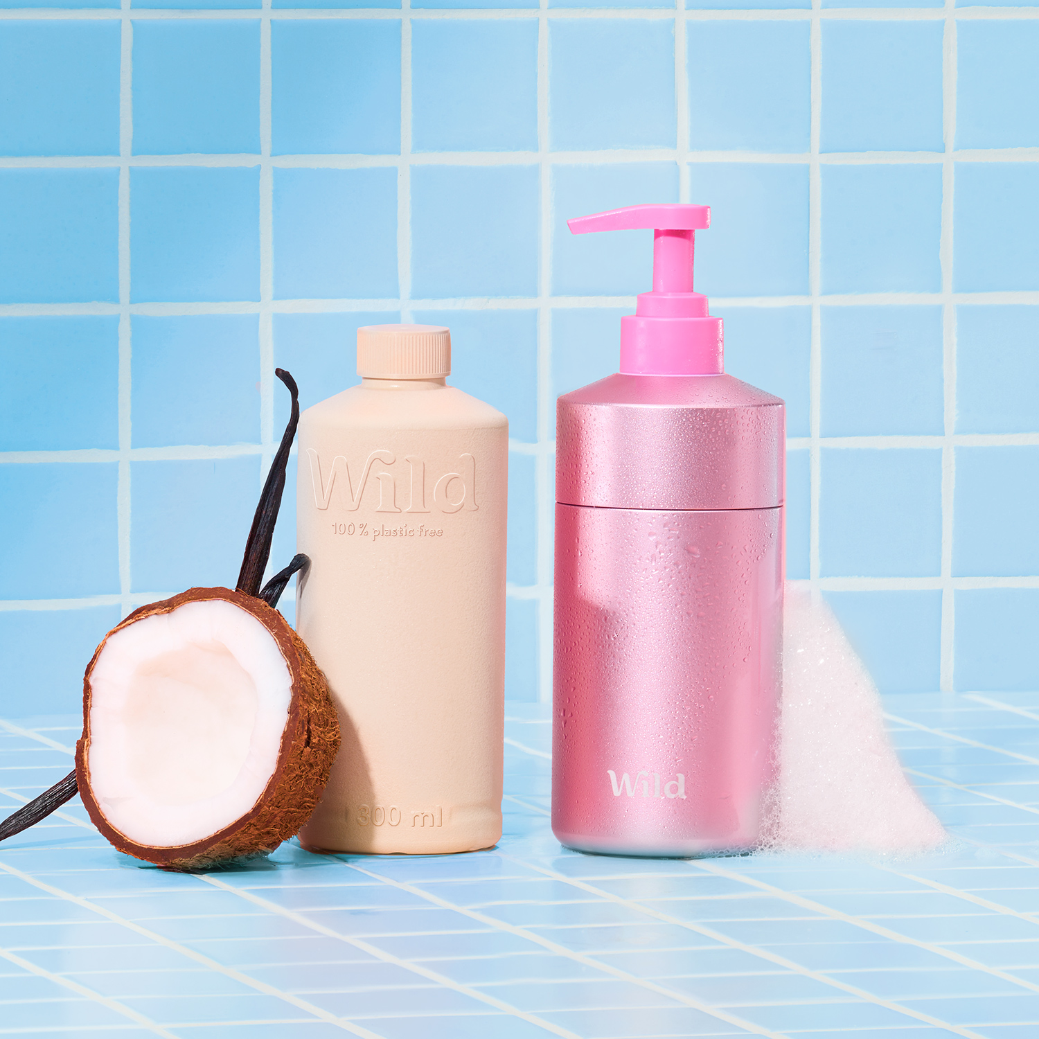 Caption: a bottle of lotion and a coconut on a blue tiled surface
