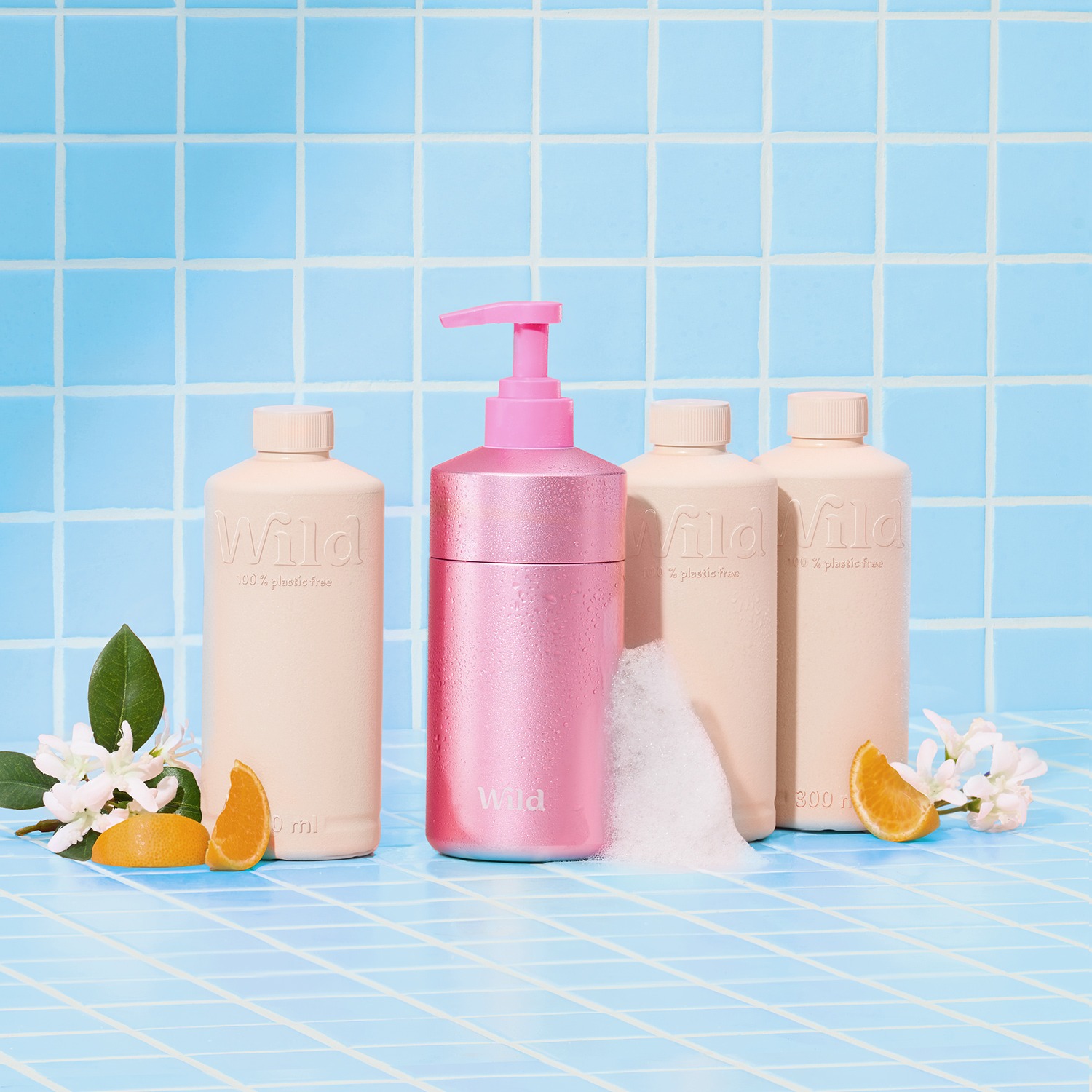 Caption: a bottle of lotion next to three bottles of lotion