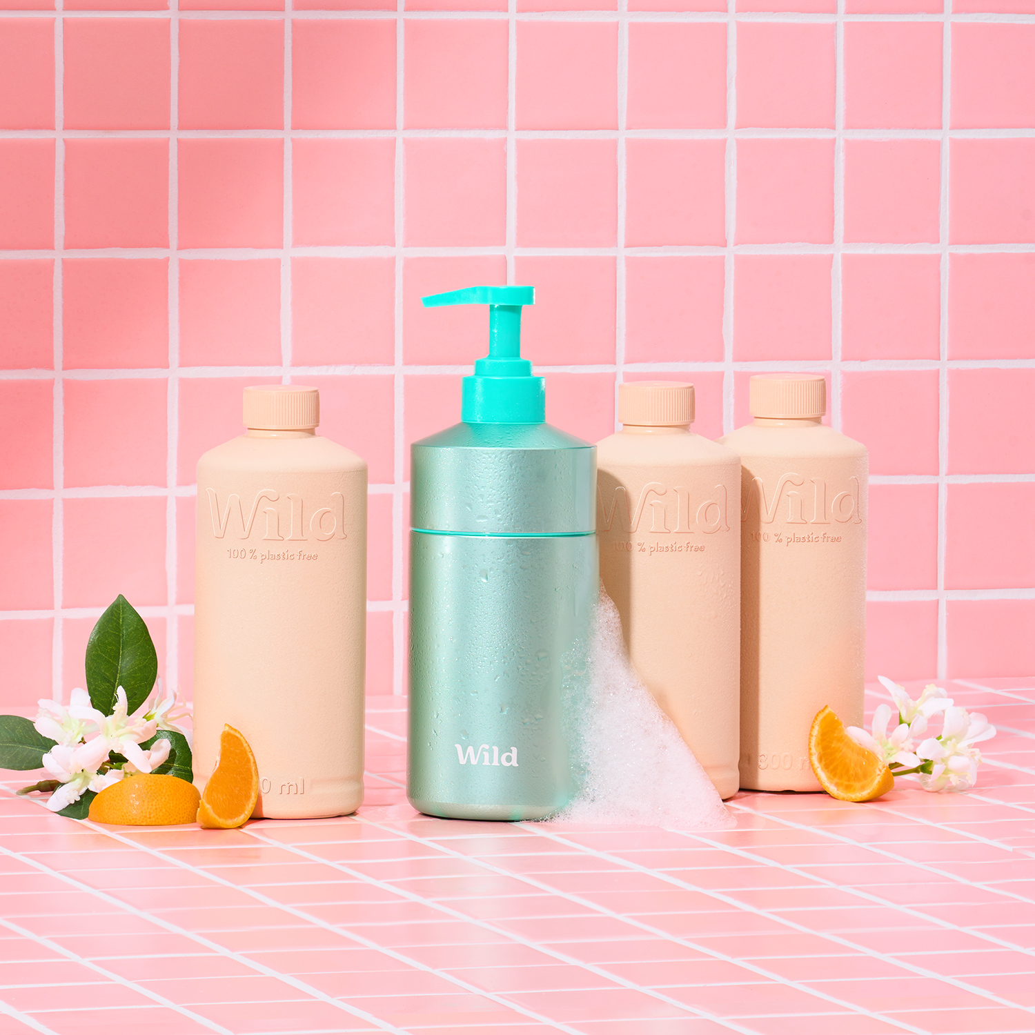 Caption: a bottle of lotion next to three bottles of lotion