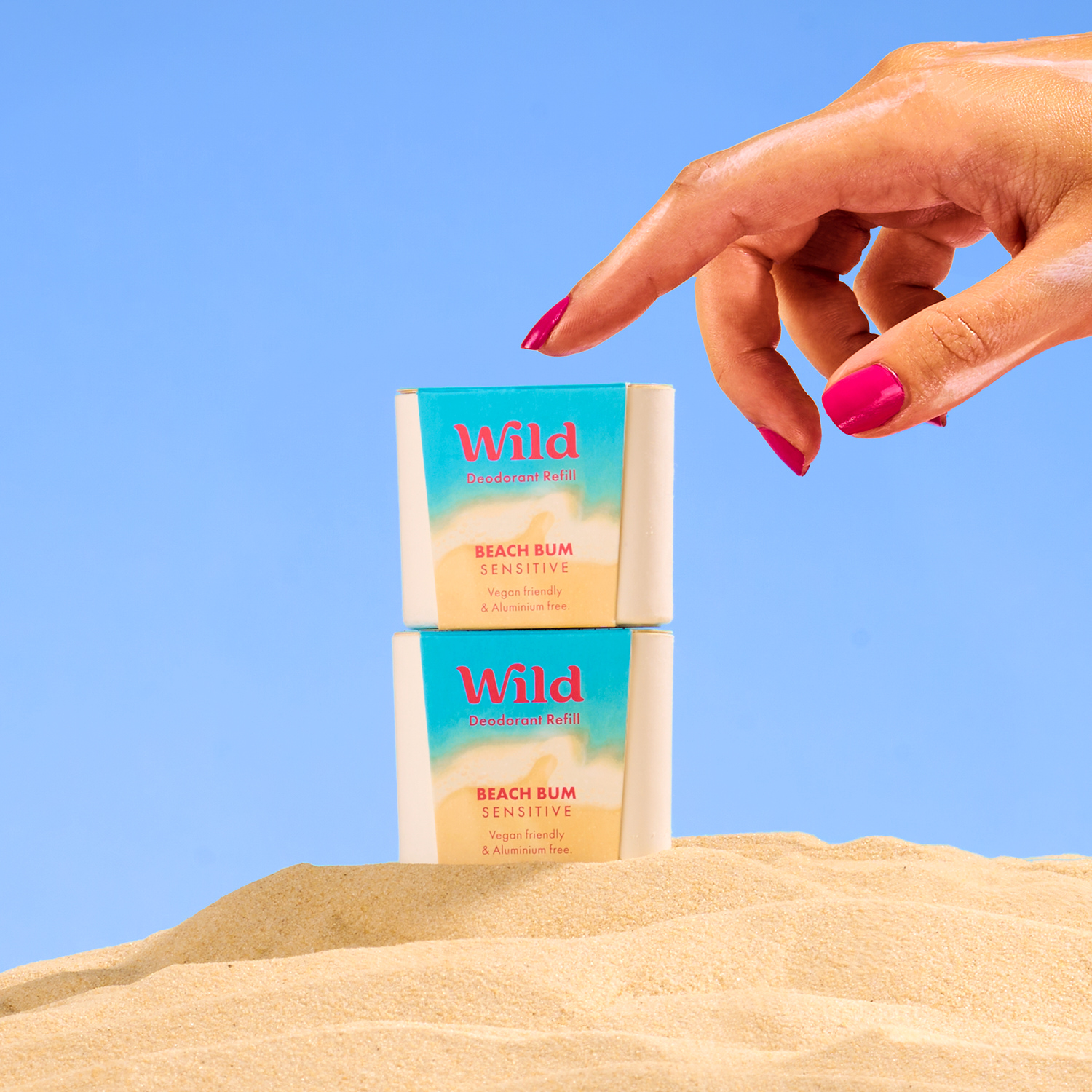 Caption: a woman's hand reaching for a tube of deodorant