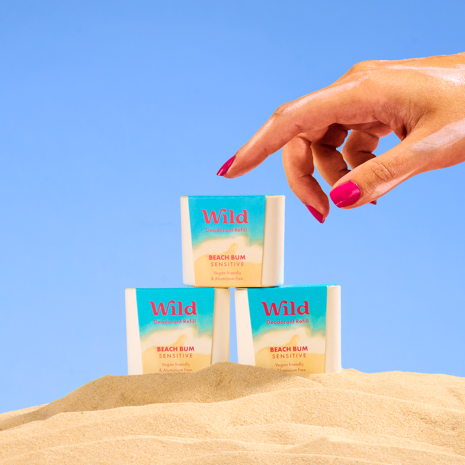 Caption: a woman's hand reaching for three packets of wind soap