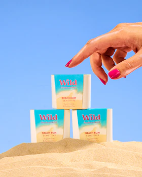 Caption: a woman's hand reaching for three packets of wind soap