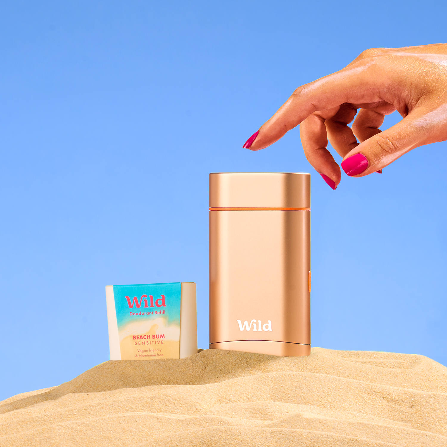 Caption: a woman's hand reaching for a bottle of wild