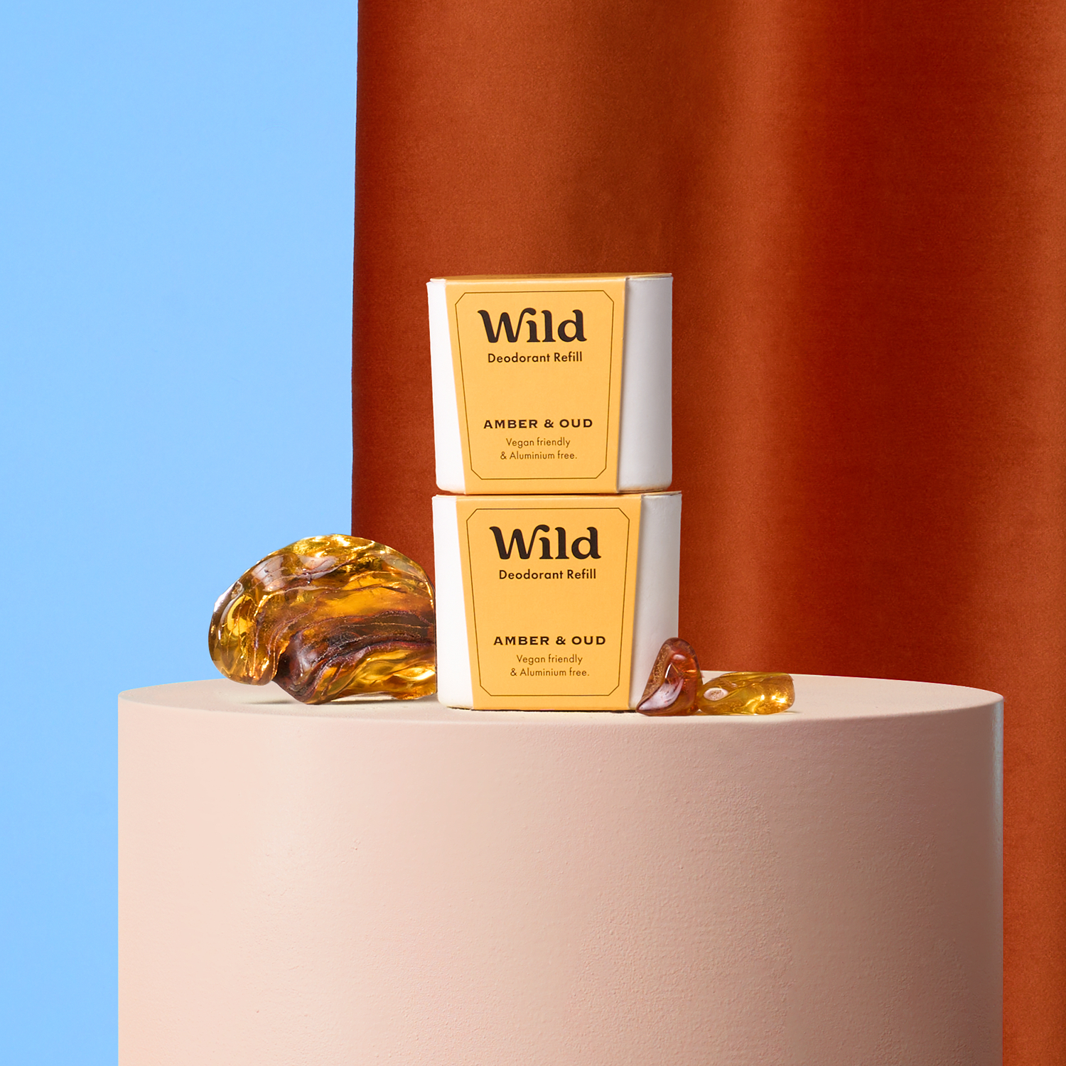 Caption: a couple of soaps sitting on top of a white pedestal