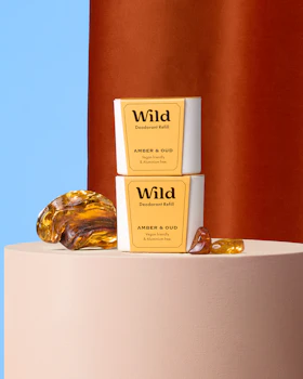 Caption: a couple of soaps sitting on top of a white pedestal