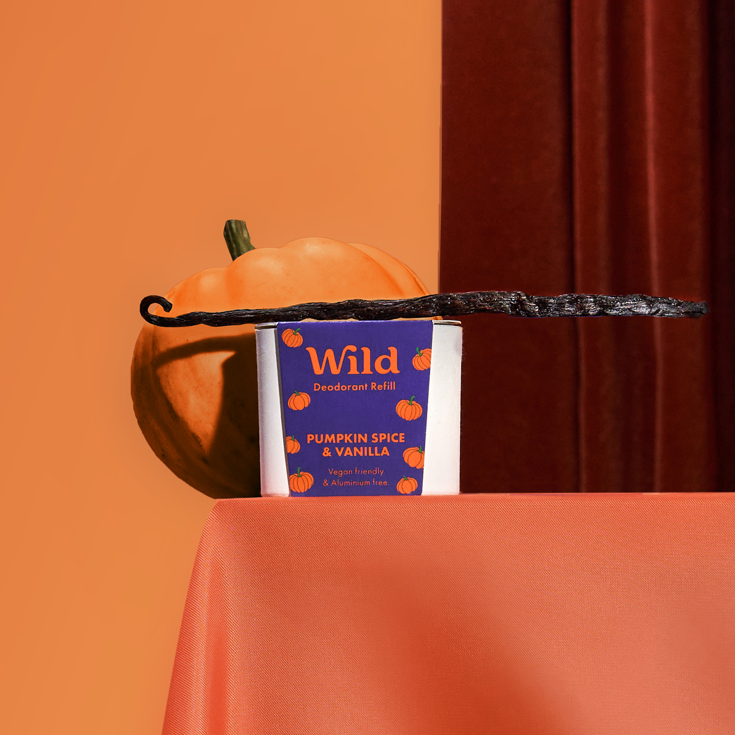 Caption: a table topped with a book and a pumpkin