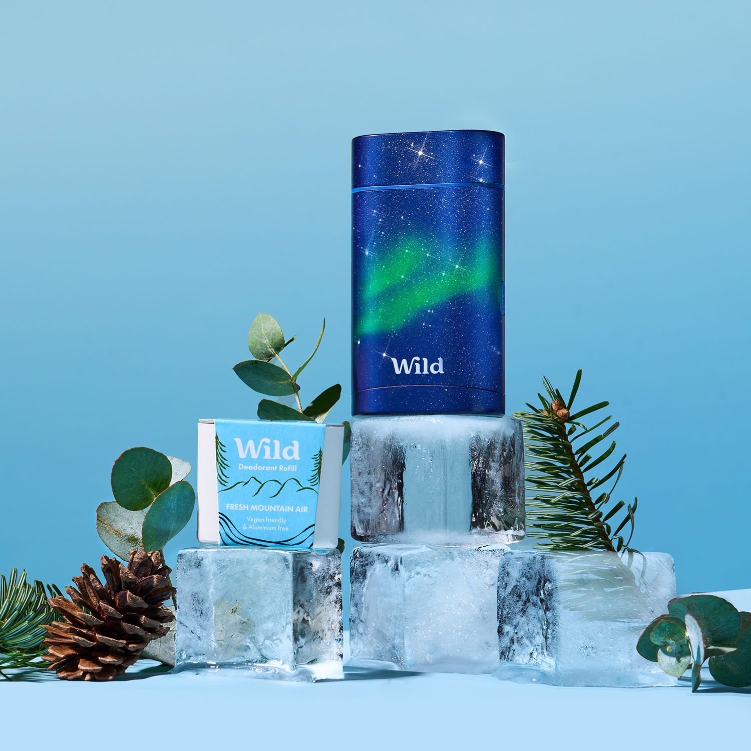 Caption: a bottle of wild sitting on top of a block of ice