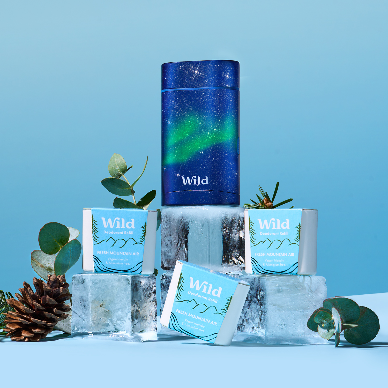 Caption: a stack of ice cubes sitting next to a can of wild